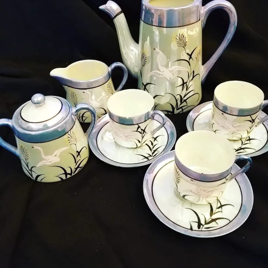 A lustreware coffee service painted with cranes