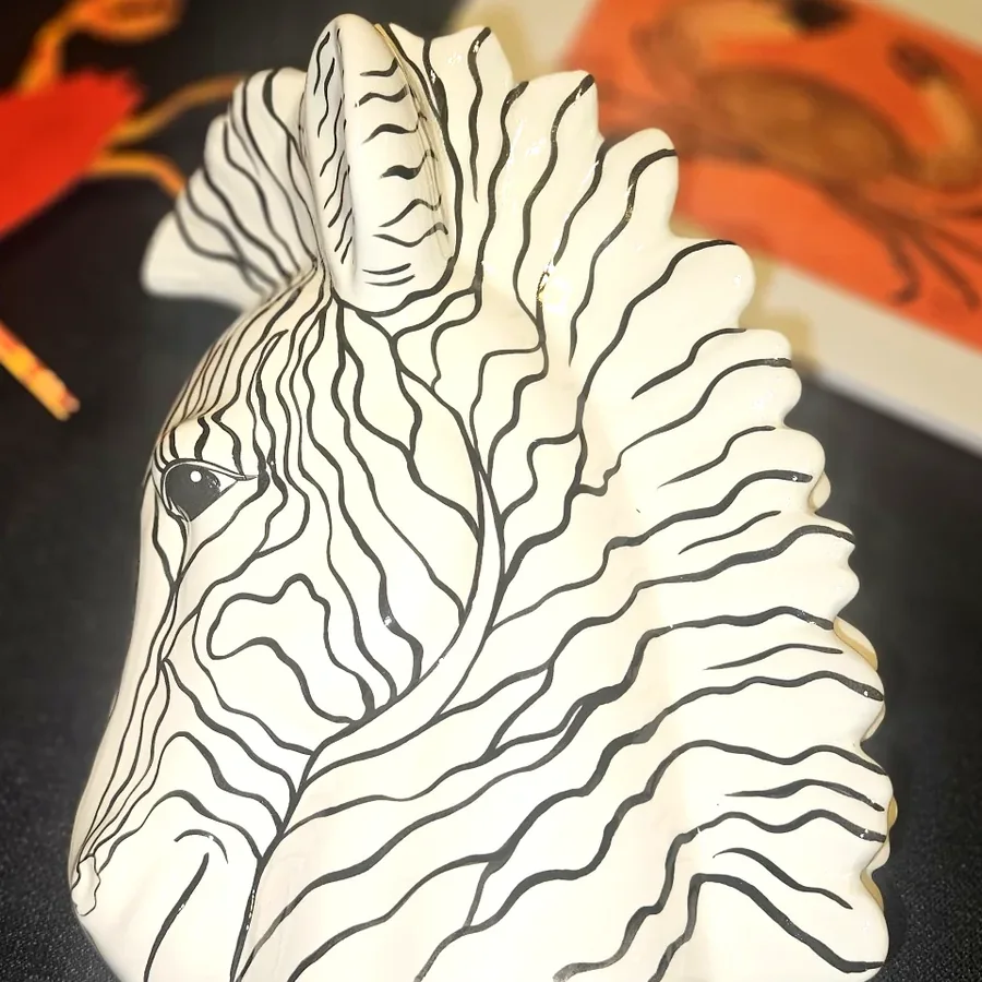 A hand striped ceramic zebra head